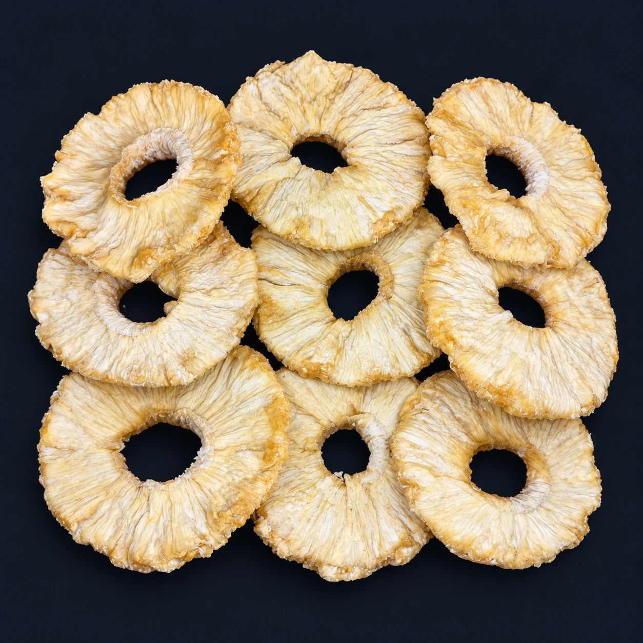 Dried pineapple rings on a dark background, Eurasian Bridge